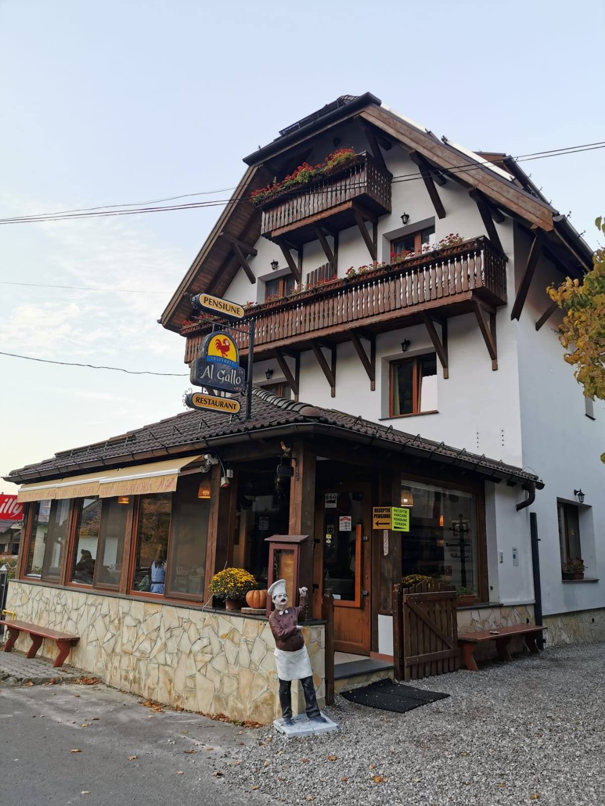 The exterior and terrace of Trattoria Al Gallo, in Bran